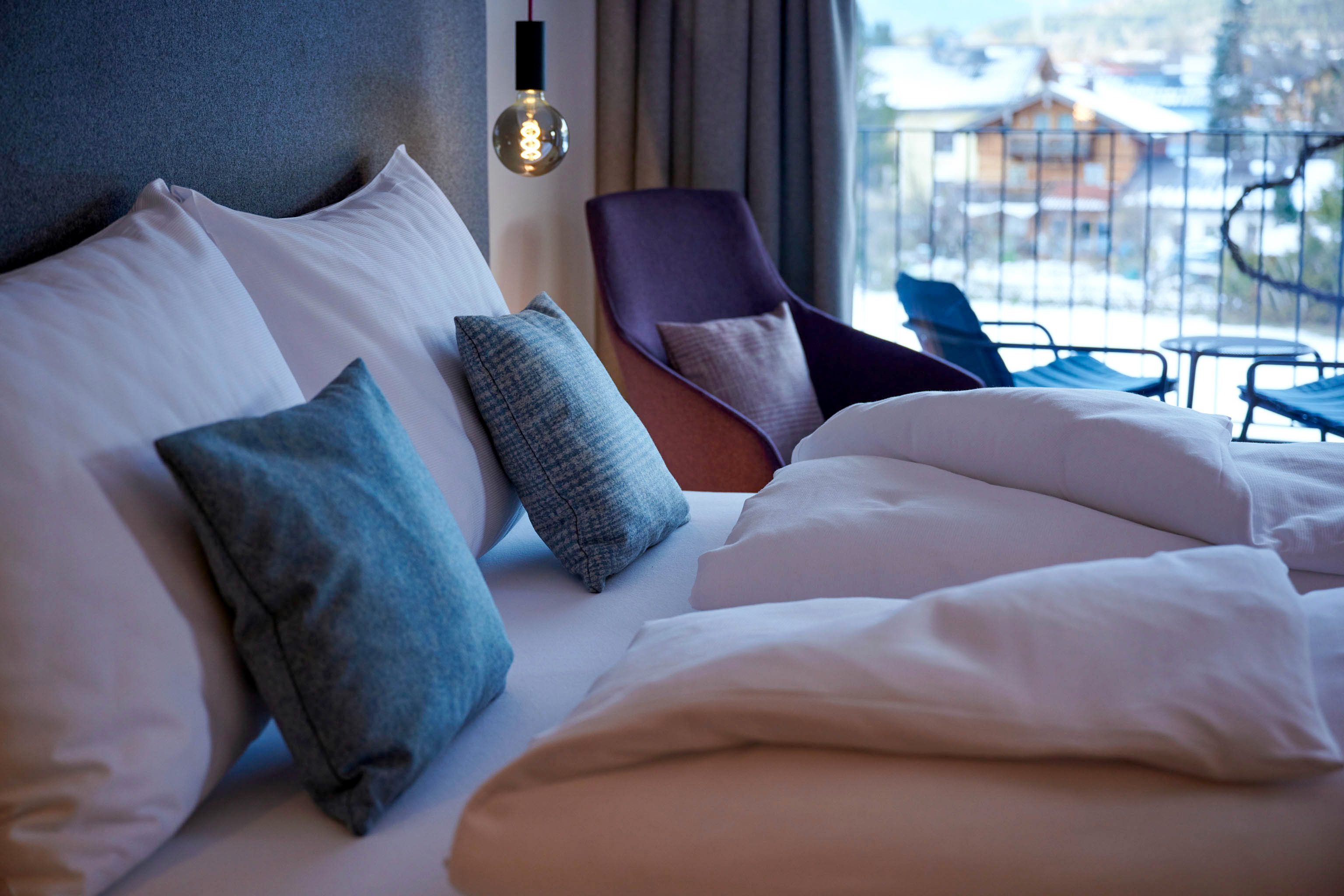 Comfortable box spring bed in a double room at Hotel MorgenZeit.